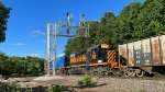 WE 7012 passes under the eastbound signals at BD.